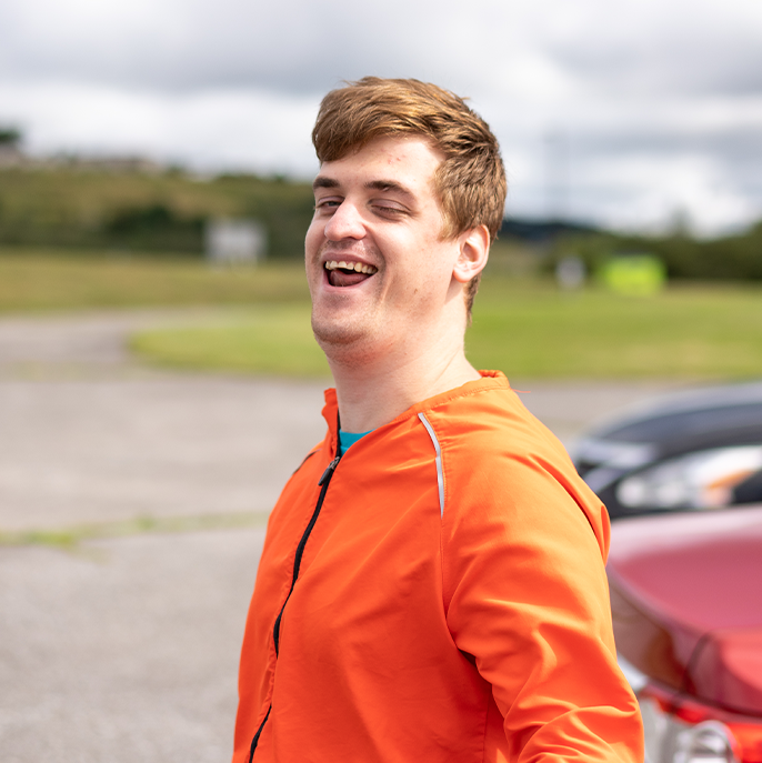 Fredericton - A coremember smiling outside