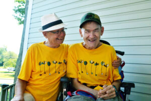 two community members smiling