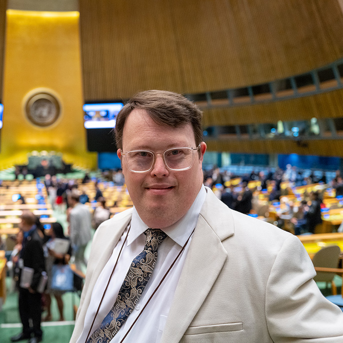 Nick Herd smiling as he represents L'Arche Canada at the 2023 UN General Assembly in New York.