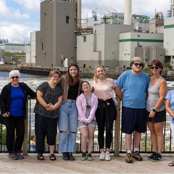 A group people including 6 women and 1 man from L'Arche Saint John standing together.